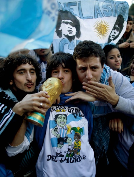 <b>ALL FOR THE CUP: </b>There is clearly more PDA for the World Cup.....Fans of Argentina's soccer team hope Messi will make their dream come true. (AP Photo)