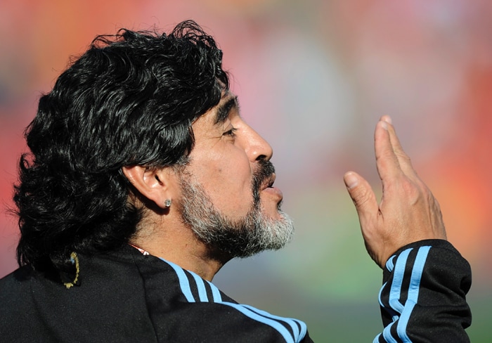 <b>THE COOLEST ONE!!: </b>This ones from the "God of Soccer"....or the "Hand of God" ?? Argentina coach Diego Maradona blows a kiss to the appreciative fans. (AP Photo)