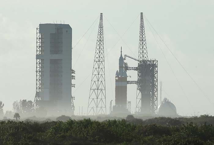 A NASA Orion capsule on top of a Delta IV rocket sits on the pad at Complex 37 B at the Cape Canaveral Air Force Station, Thursday, Dec. 4, 2014, at Cape Canaveral, Florida.