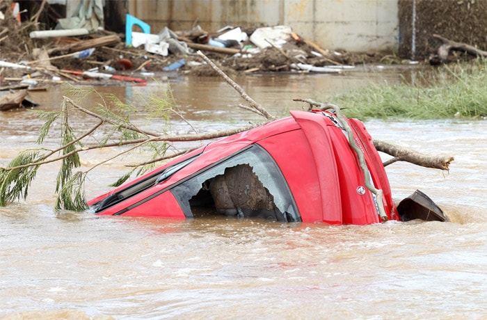 <b>Mass destruction:</b> A car wreck outside the town of Grantham in South East Queensland, Australia, Wednesday, Jan. 12, 2011. Deadly floodwaters that have cut a swath across northeastern Australia flowed onto the streets of Brisbane, the nation's third-largest city, forcing people to flee suburbs and skyscrapers. (AP Photo)
