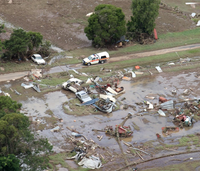 <b>Destruction all around:</b> Vehicles swept away during flash flooding scatter the country side in South East Queensland, Australia, Wednesday, Jan. 12, 2011. Deadly floodwaters that have cut a swath across northeastern Australia flowed onto the streets of Brisbane, the nation's third-largest city, forcing people to flee suburbs and skyscrapers. (AP Photo)