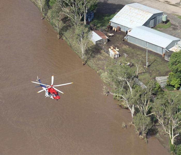 <b>Help from the skies:</b> There are other people too, who tried to make a difference. Video of an Australian pilot rescuing people during the Queensland flood disaster was released on Thursday. (AP Photo)