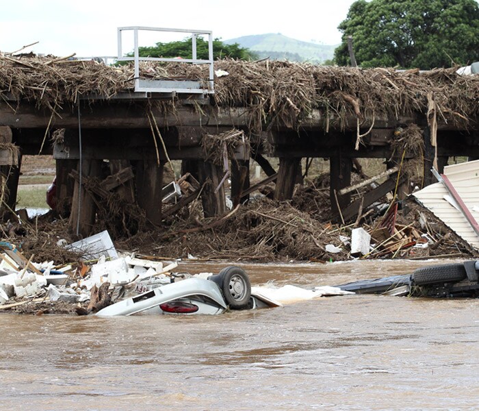 <b>After the inland Tsunami:</b> Car wrecks outside the town of Grantham in South East Queensland, Australia, Wednesday, Jan. 12, 2011. The small town was hit by flash flooding causing mass destruction. Deadly floodwaters that have cut a swath across northeastern Australia flowed onto the streets of Brisbane, the nation's third-largest city, forcing people to flee suburbs and skyscrapers. (AP Photo)
