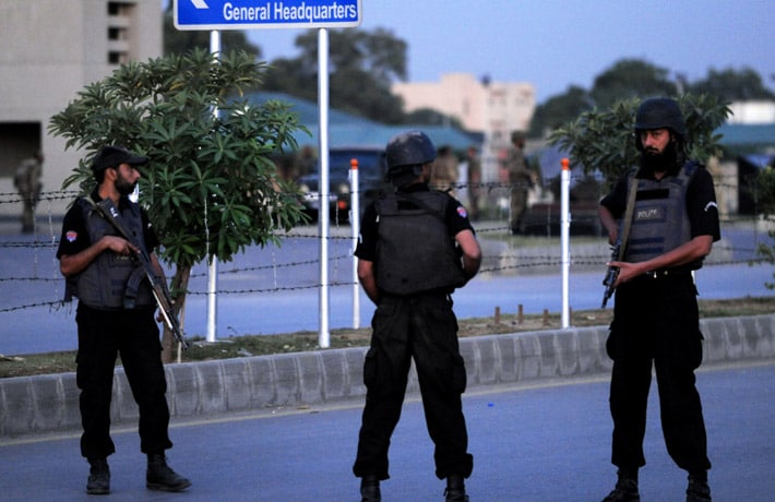 Ending a 20-hour siege, Pakistani commandos on Sunday stormed a building near army headquarters in Rawalpindi where heavily-armed terrorists were holed up after targeting the top military facility in a brazen attack, freeing 30 hostages and killing four attackers. (AFP Photo)