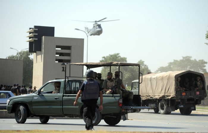 Terrorists attacked the Pakistan Army Headquarters in Rawalpindi on Saturday. Heavy firing went on for&nbsp;long outside the headquarters.<br />
<br />
Tehreek-e-Taliban Pakistan claimed the responsibility for the attack. (AFP Photo)