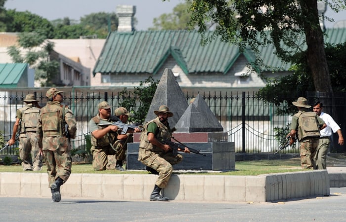 Unidentified gunmen in a vehicle opened fire when soldiers at a check post near the General Headquarters tried to stop it. This sparked an intense shootout. (AFP Photo)