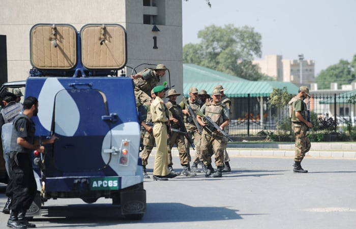 An eyewitness said there were five or six persons in the car. He added that he had seen one of them fall after being fired at by the soldiers. (AFP Photo)