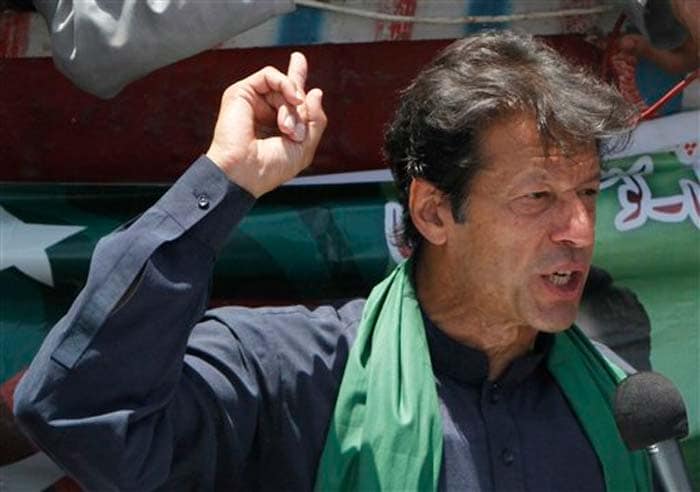 Pakistan's cricket star-turned-politician Imran Khan speaks to his supporters during an election campaign in Karachi, Pakistan on Tuesday, May 7, 2013. One of Pakistan's most prominent politicians,Mr Khan, fell 15 feet from a stage at a political rally Tuesday in Lahore, injuring him.