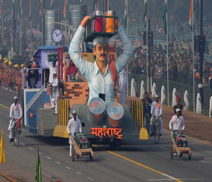 A float carrying a tableau from Maharashtra state showcasing the famous "Dabbawallas" rolls past during the final full dress rehearsal for the Indian Republic Day parade in New Delhi. (AFP Photo)