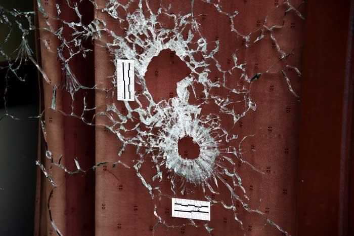 Bullet holes scar the windows of the Carillon and the adjacent Cambodian restaurant on Rue Alibert in the 10th district, of the French capital Paris, on November 14, 2015. (AFP Photo)