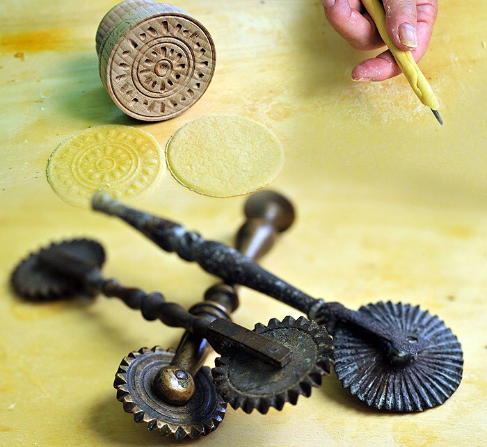 <p>Pre-eminent Italian food historian Oretta Zanini de Vita seems to have a tool for every pasta: a centuries-old ravioli cutter, a wooden stamp that mints pasta like coins, a chitarra for creating thick strands of tagliatelle. </p>
<p>Seen here, some of her 'ancient' tools. (NYT Newsservice)</p>