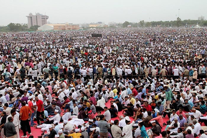 People from Patidar or Patel community hold placards and shout slogans during a protest rally demanding reservation for their community in Vadodra on Friday.