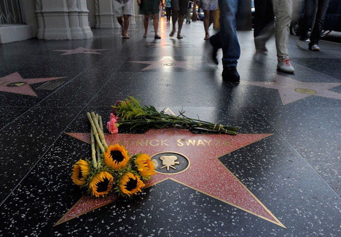 In 1997, a star was made on the Hollywood Walk of Fame on Patrick Swayze's name. Fans kept flowers on his star to mourn his death on September 14, 2009. (Photo: AP)