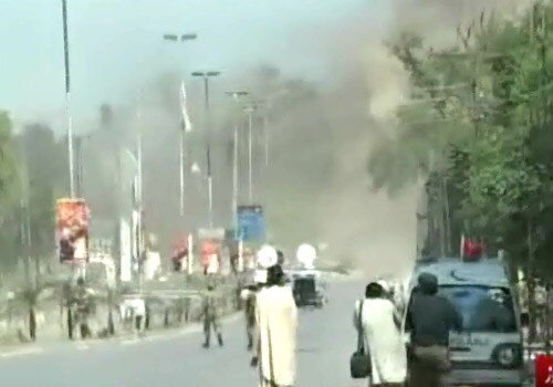 Local TV footage showed soldiers taking up defensive positions on the road outside the consulate. One soldier hit the ground in the middle of the road and began firing as a large explosion sent up a plume of gray smoke nearby. (Image Courtesy: Dawn News)