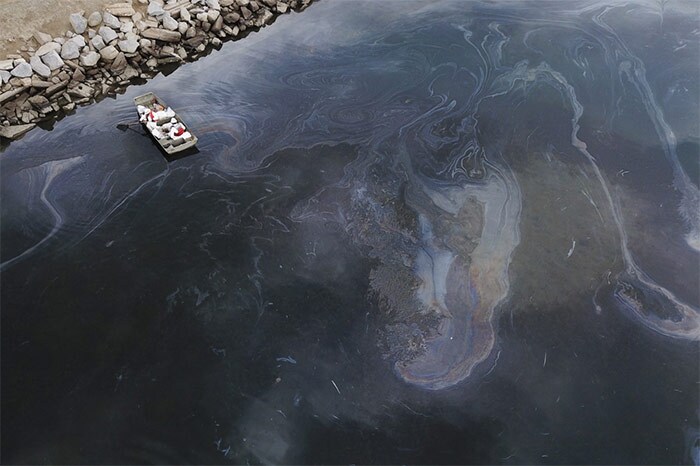 A sheen on the water after an oil spill in the Pacific Ocean in Huntington Beach, California.