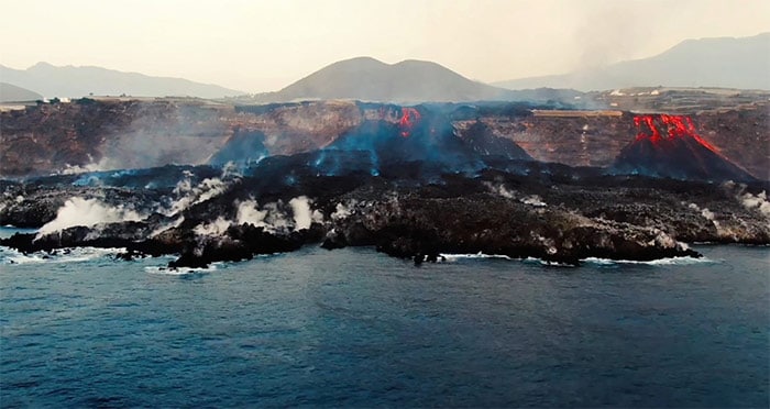 Aerial shot from oceanographic vessel Ramon Margalef (IEO) of delta formed on the coast from lava of the Cumbre Vieja volcano, on the Canary Island of La Palma.