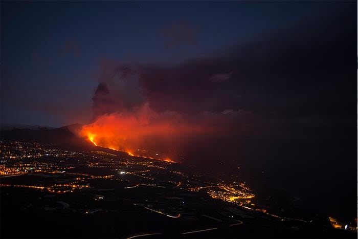 The Cumbre Vieja volcano, pictured from Tijarafe, spews lava, ash and smoke, on the Canary Island of La Palma.