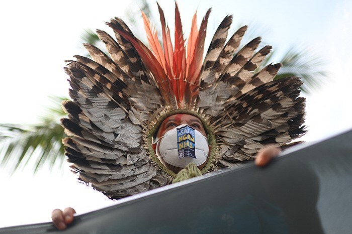 An indigenous man takes part in a protest against an auction organized by Brazil's Oil and Gas Regulatory Agency (ANP) at a hotel in Barra da Tijuca neighborhood, in Rio de Janeiro, Brazil.