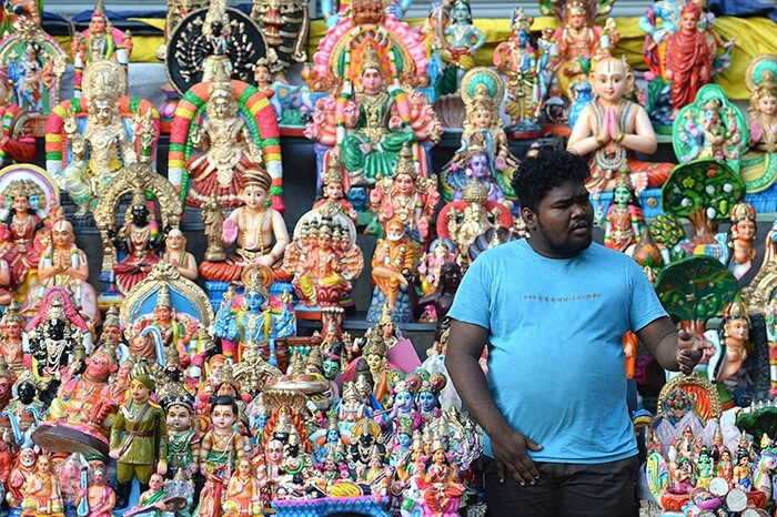 A vendor waits for customers at a stall during the Navaratri festival, in Chennai.