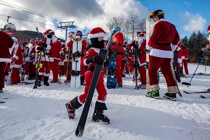 Skiers take part in the annual Santa Ski Run on Santa Sunday at Sunday River in Newry, Maine.