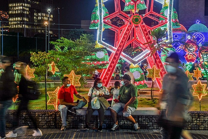 People visit the area along the Medellin river after it was decorated for the Christmas season, in Medellin, Colombia.