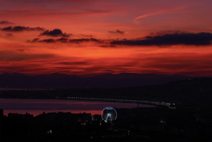 A general view of the "Baie des Anges" at sunset on the french riviera in Nice.