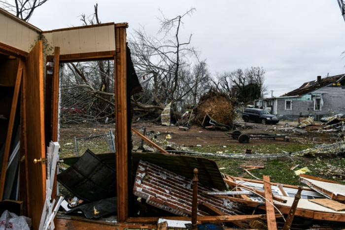 A fallen tree is seen on the ground from inside the destroyed house in Cayce, Kentucky.