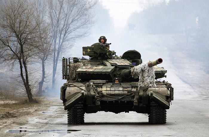 Ukrainian servicemen ride on tanks towards the front line with Russian forces in the Lugansk region of Ukraine.