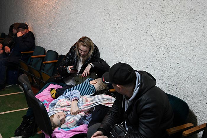People gather in an air raid shelter in Kyiv.