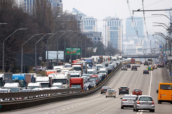 Residents leaving Central Kyiv are pictured stuck in a highway.