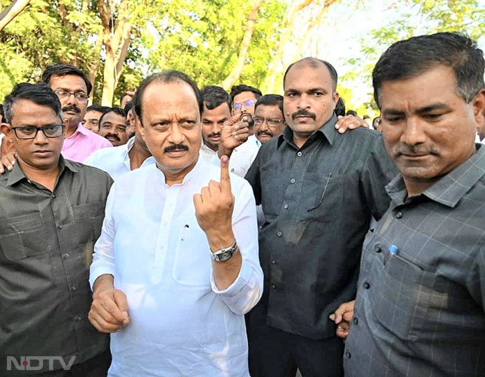 Maharashtra Deputy chief minister Ajit Pawar casts vote at a polling booth in Baramati.