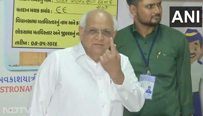 Gujarat Chief Minister Bhupendra Patel casts his vote at a polling booth in Ahmedabad.