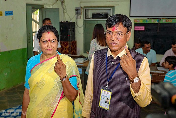Union Health Minister and BJP candidate from Porbandar, Mansukh Mandaviya and his wife Neeta cast votes at Hanol Primary School in Porbandar.