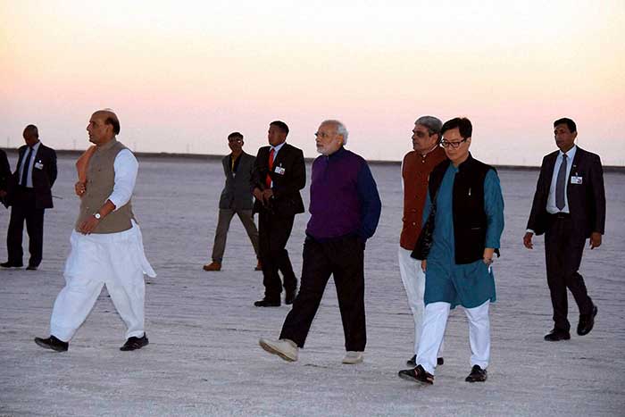 Prime Minister Narendra Modi, Home Minister Rajnath Singh and MoS for Home Kirren Rijiju leave after a meeting during 3-day DGP Conference at Dhordo. (PTI Photo)