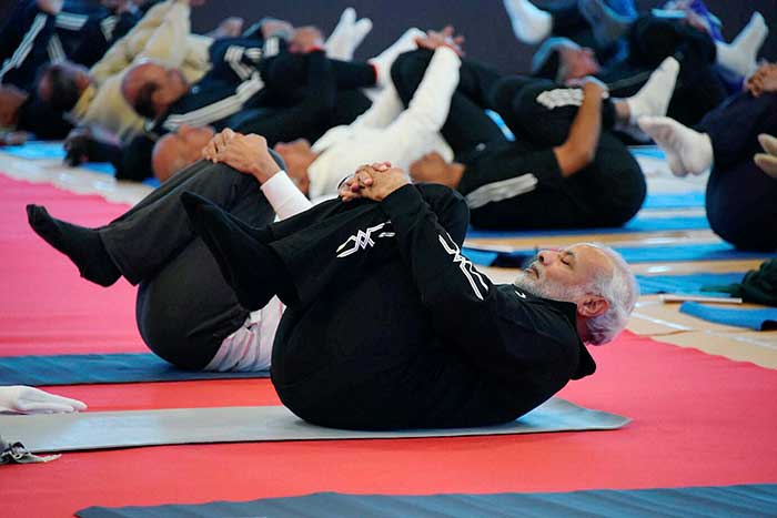 PM Modi leads a yoga session for top police officers at a annual conference in Rann of Kutch. (PTI Photo)