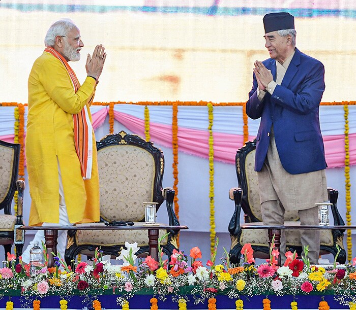 Prime Minister Narendra Modi greeting his Nepalese counterpart Sher Bahadur Deuba.