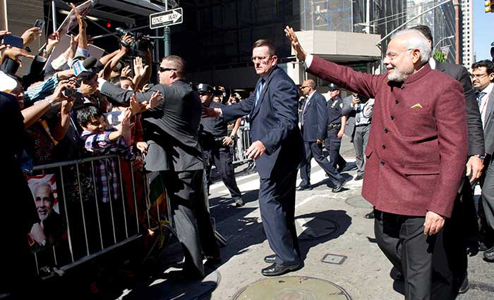 PM Modi, 64, flew into New York's JFK airport on a special Air India Boeing plane on the first leg of his maiden visit to the US as Prime Minister after a nearly nine-hour flight from Frankfurt where he had an overnight halt.<br><br>Then, in a rare gesture, PM Modi came out of his huge convoy to greet a large number of Indians who had gathered outside his hotel to welcome him on his arrival to the US and were chanting his name.