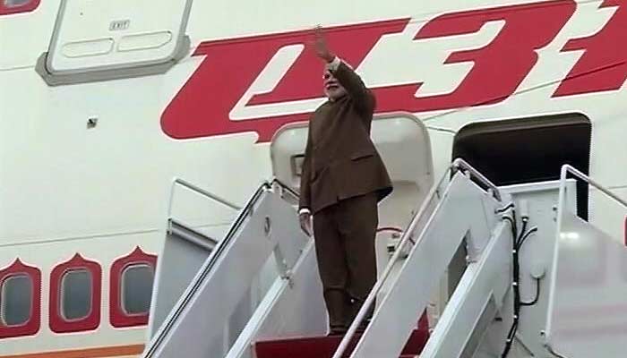 PM Narendra Modi waves after disembarking from the aircraft on his arrival in Washington on September 29, 2014.