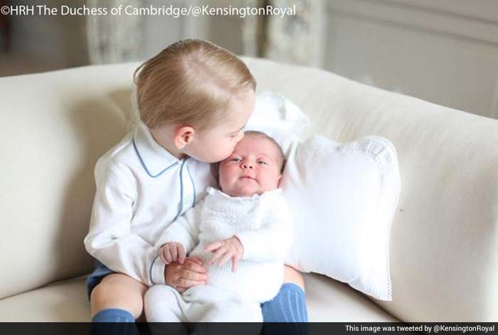 First Glimpse of the Royal Siblings: Prince George Plants a Kiss on Princess Charlotte