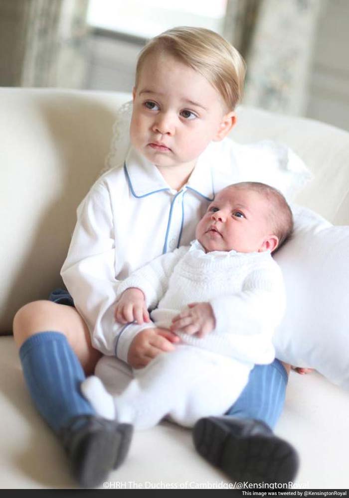 First Glimpse of the Royal Siblings: Prince George Plants a Kiss on Princess Charlotte