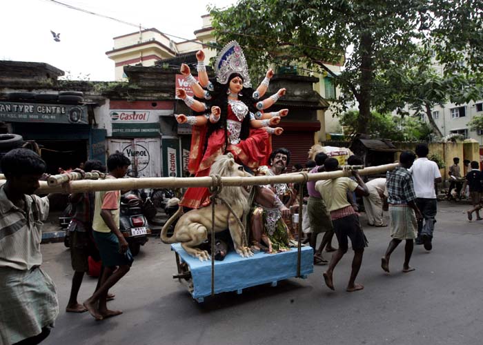 People carry an idol of Goddess Durga to a venue of worship in preparation for the Durga Puja festival in Calcutta on Wednesday, September 23, 2009. (AP Photo)