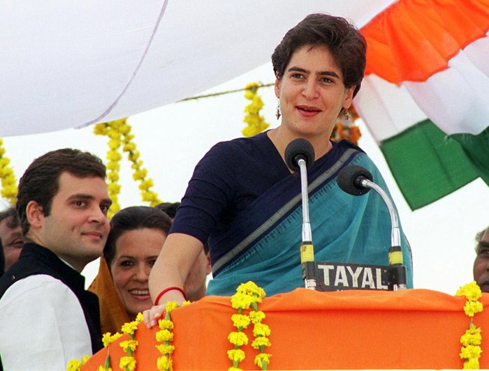 Even then he was content to let Priyanka take the center stage. In this February 1, 1998 file photo, he accompanies his mother Sonia at a Congress Party election campaign rally in Amethi. His sister Priyanka can be seen exhorting the crowds to vote for the Congress Party. (Photo: AFP)