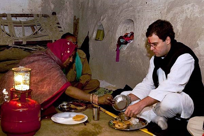 In the last few years, Rahul has proved himself a 'people's politician' time and again. In Uttar Pradesh and other states, he has made a habit of staying in the homes of Dalits to show Congress is not aloof from the 'aam admi'. In this December 23, 2009 photo he is seen having dinner in a Dalit household, in Goawali village of Jhansi district. Before this he had joined another Dalit family for dinner in a village in Amethi in 2008. (Photo: PTI)