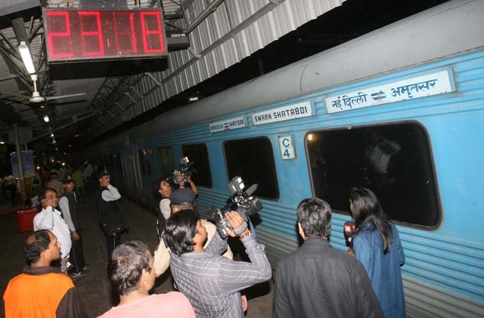 Media persons thronged the coach of the Swarn Shatabdi Express in which Congress general secretary Rahul Gandhi was travelling from Ludhiana to New Delhi on Tuesday. (PTI Photo)