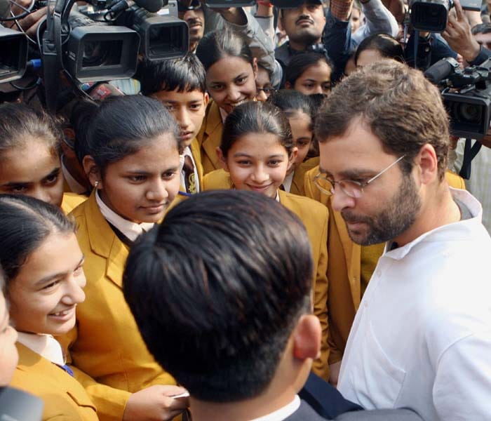 There were about 50 children in the group. After witnessing the Question Hour in Lok Sabha, they were waiting outside Parliament when the Amethi MP met them. (PTI)