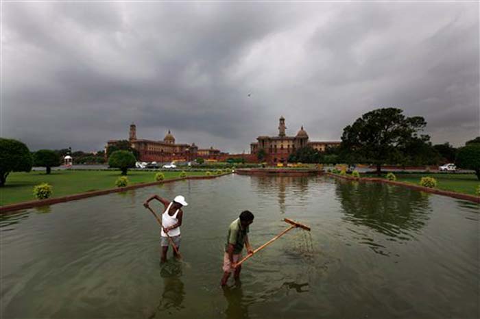 Monsoon arrived in Delhi a fortnight ahead of schedule June 16 but the metropolis had been witnessing almost a dry spell since June 17. Here, municipal workers clear fountain at Raisina Hills.