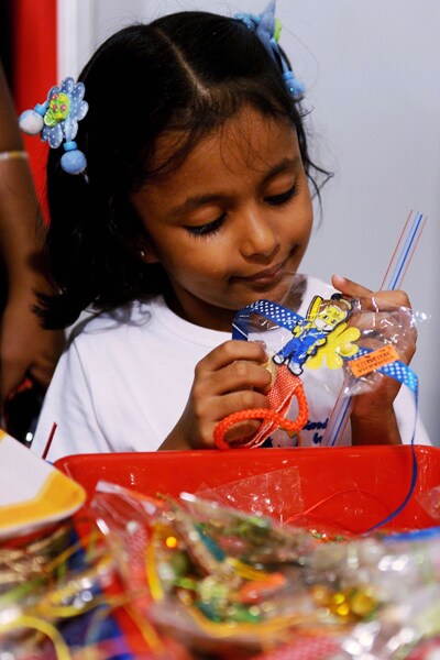 A young girl chooses a rakhi, at an exhibition in Amritsar. (AFP Photo)