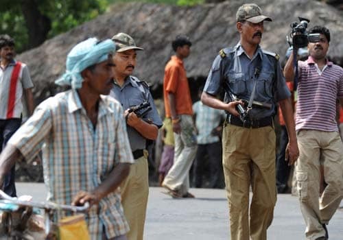 <b>Safeguarding:</b> Policemen patrol outside the village where three Communist Party of India-Marxist (CPM) workers were killed by suspected Maoists.(AFP)