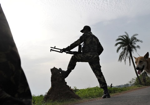 <b>Ready for action:</b> A paramilitary soldier takes position as armed forces personnel proceed towards Lalgarh in Midnapore district, some 200 kms west of 

Kolkata. (AFP)