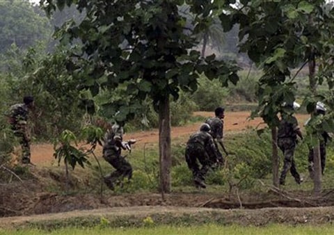 <b>Moving in:</b> Paramilitary soldiers take position during an encounter with Maoist rebels at Bhimpur. (AP)